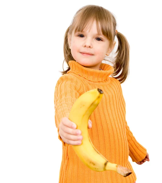 Criança come banana — Fotografia de Stock