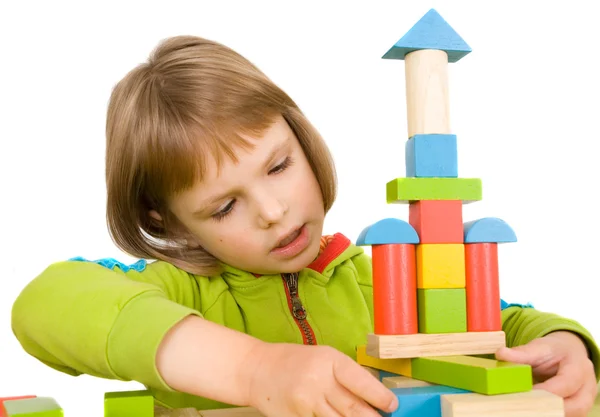 Child plays with toy blocks Stock Photo
