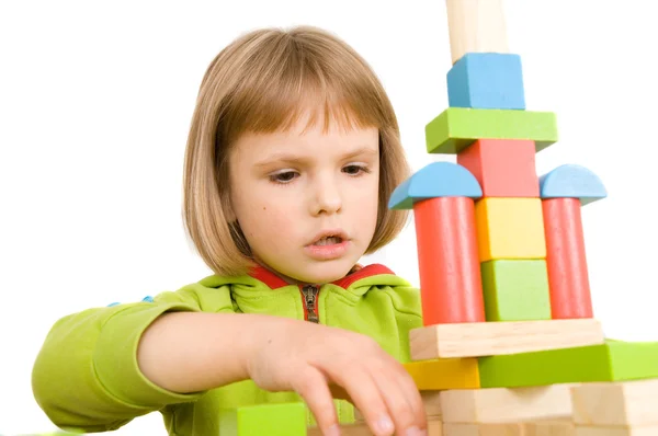 Child plays with toy blocks Royalty Free Stock Photos