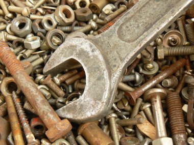 Rusty metal fasteners and wrench clipart