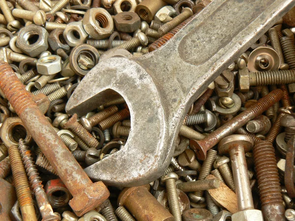 Rusty metal fasteners and wrench — Stock Photo, Image