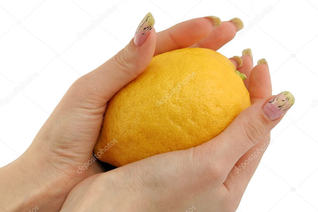 Lemon and woman hands