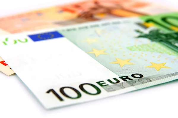 Algumas notas de euro num fundo branco — Fotografia de Stock