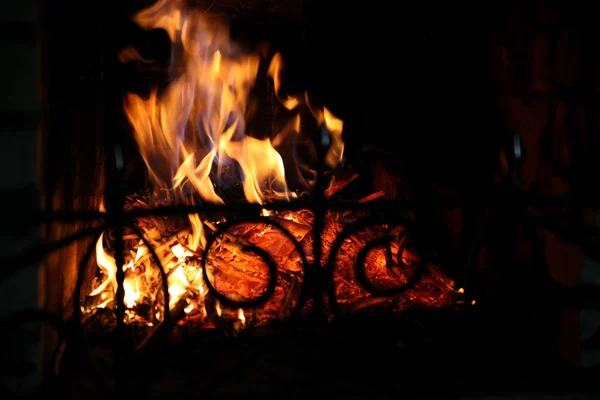 Close-up of fire and flames on a black b — Stock Photo, Image