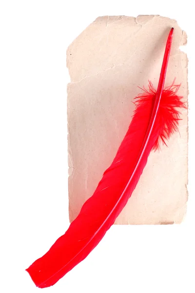 Античная красная ручка на старой бумаге, изолированной на — стоковое фото