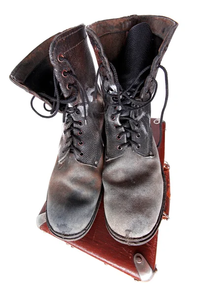 Old good boots at vintage suitcase isola — Stock Photo, Image