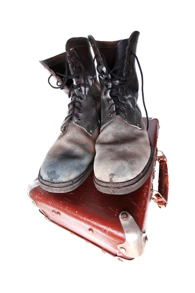 Old good boots at vintage suitcase isola — Stock Photo, Image