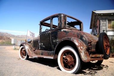 Old car in historic rout 66, arizona clipart
