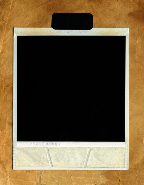 Ретро фото рамка против старой бумаги — стоковое фото