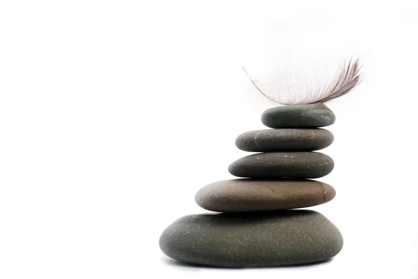 Five Zen stones with feather — Stock Photo, Image