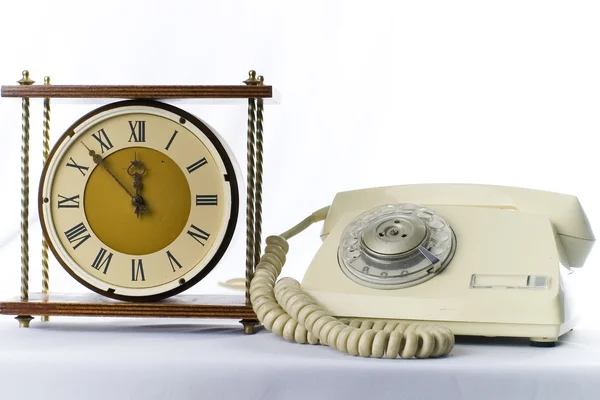 Vintage telephone and old analoque clock — Stock Photo, Image