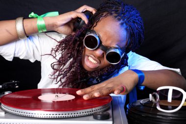 Cool afro american DJ in action clipart