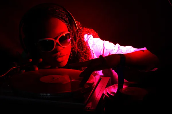 Afro american DJ under red light — Stock Photo, Image
