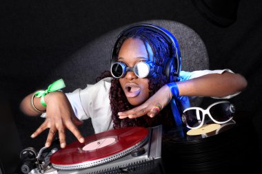 Cool afro american DJ in action clipart