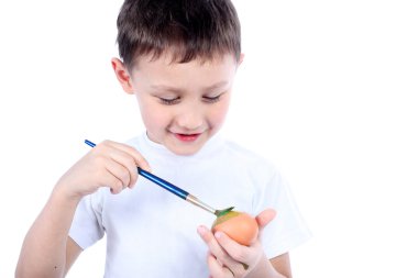 Boy painting easter egg clipart