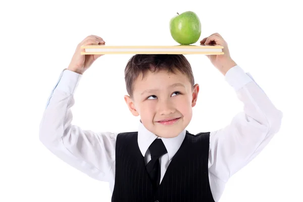 Skolpojke med bok och äpple — Stockfoto