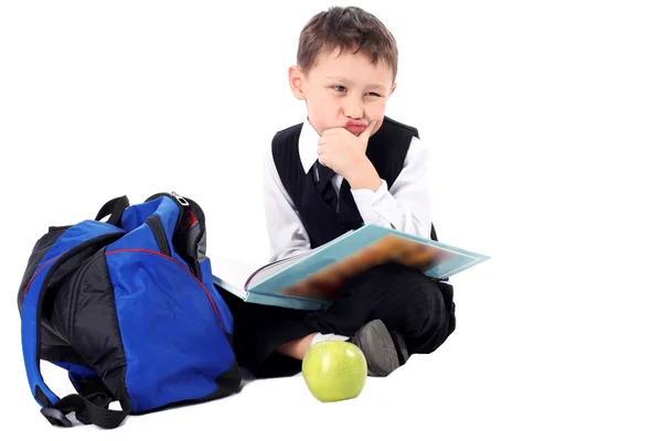 Learning - schoolboy with book and — Stock Photo, Image