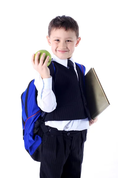 Estudante com livro e maçã — Fotografia de Stock
