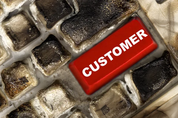 Burned keyboard with red button — Stock Photo, Image