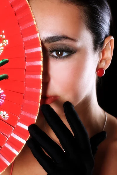 stock image Latino woman with red fan