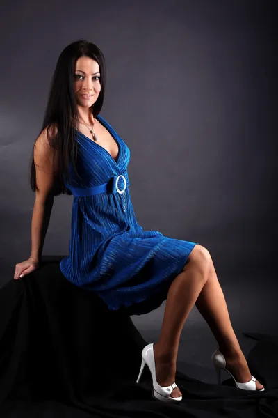 Fashion young woman in blue dress — Stock Photo, Image