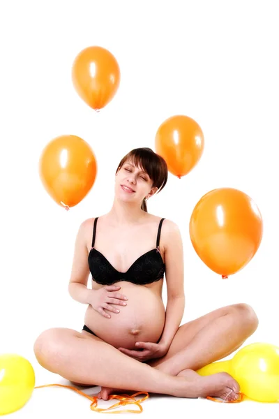 Mãe expectante com balões — Fotografia de Stock