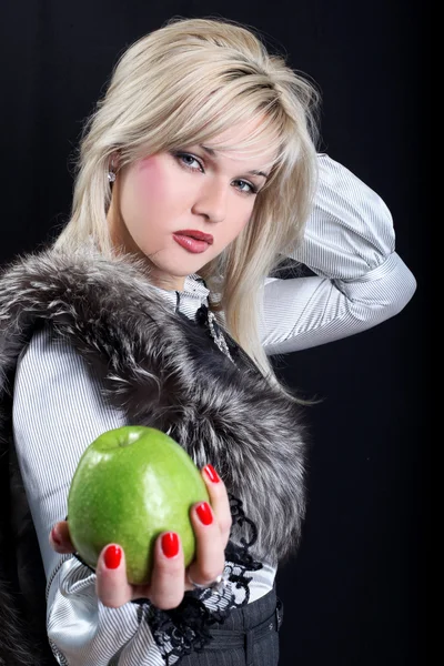 Girl with fur with apple — Stock Photo, Image