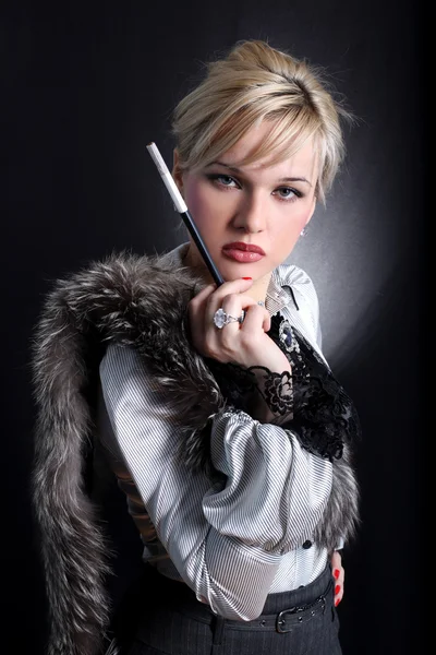 Woman in fur with mouthpiece — Stock Photo, Image