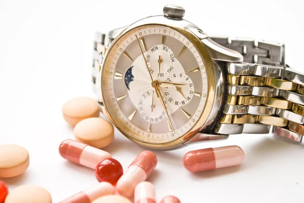Clock and pills — Stock Photo, Image