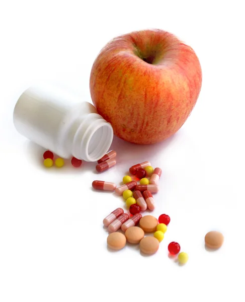 Jabłko i tablete — Zdjęcie stockowe