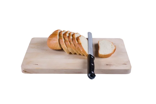 A vágott kenyeret egy vágódeszka. — Stock Fotó
