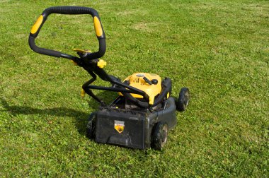 Lawnmower on a lawn. clipart