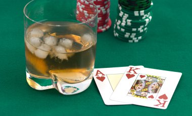 Counters of a card and a glass of whisky clipart