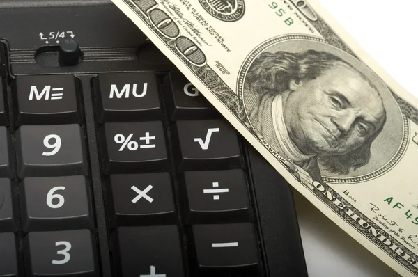 De rekenmachine en geld. — Stockfoto