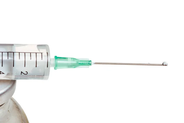 Drop on a syringe needle. — Stock Photo, Image