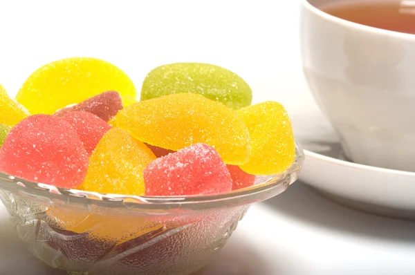 Fruit candy and tea — Zdjęcie stockowe