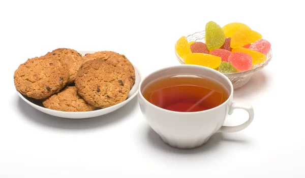 Τσάι, μπισκότα και φρούτα καραμέλα. — Φωτογραφία Αρχείου