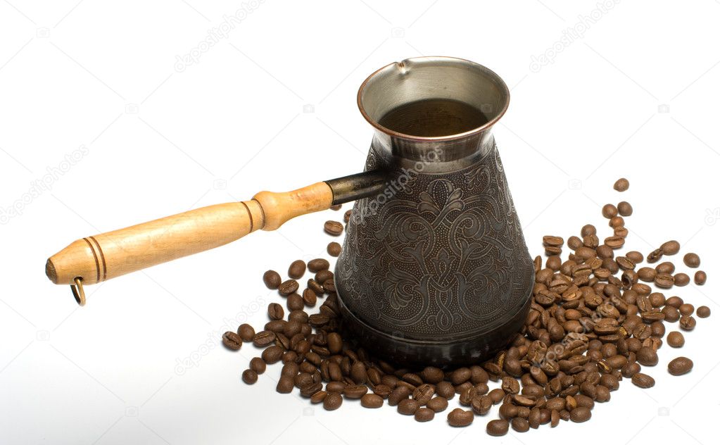 Coffee-pot and coffee grains.