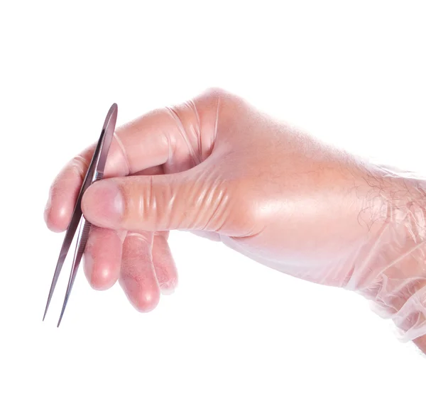 Hand in rubber glove holding tweezers — Stock Photo, Image
