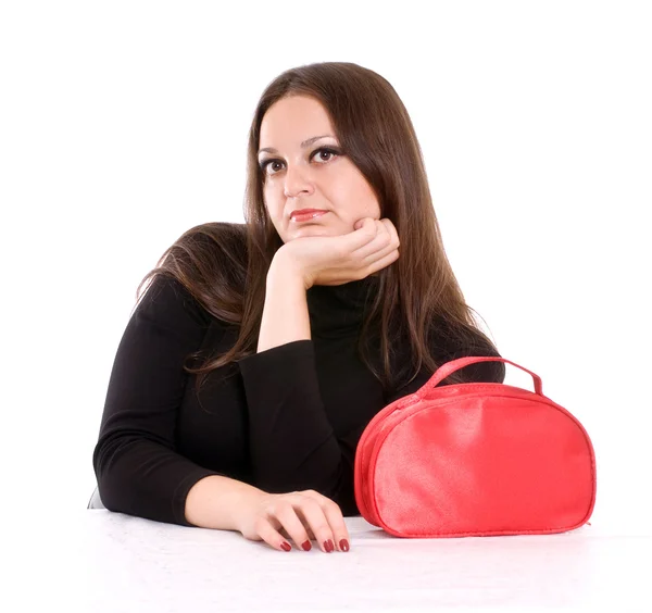Mujer joven con bolsa cosmética roja —  Fotos de Stock