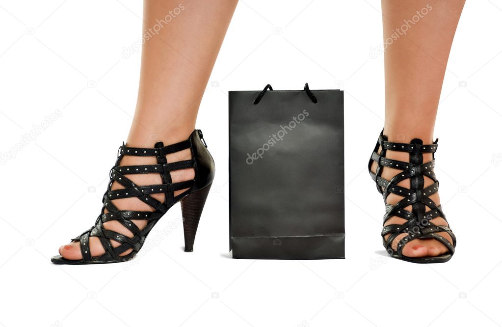 Women legs in wreathy shoes stand behind