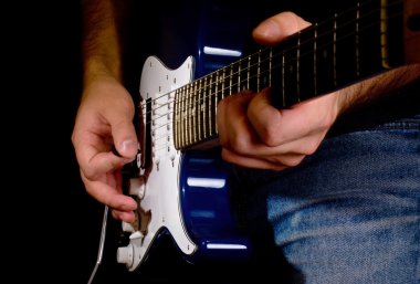 Guitar playing in the move clipart