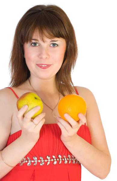 Menina com laranja e maçã nas mãos — Fotografia de Stock