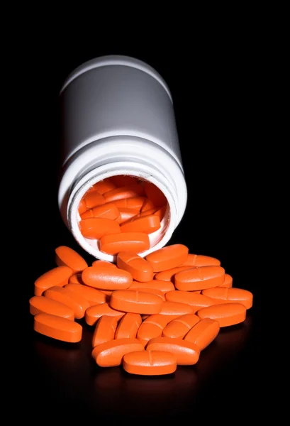 Üveg ömlött tabletták — Stock Fotó