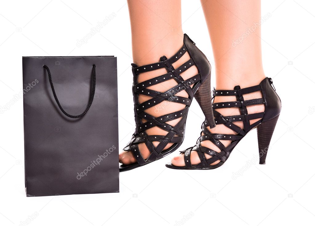 Women legs kick shopping bag