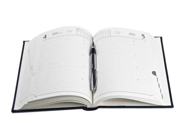Reservoarpenna på öppnade dagbok — Stockfoto