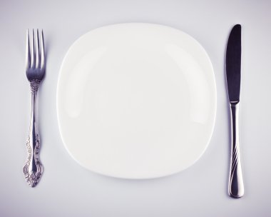 Empty white dish knife and fork clipart