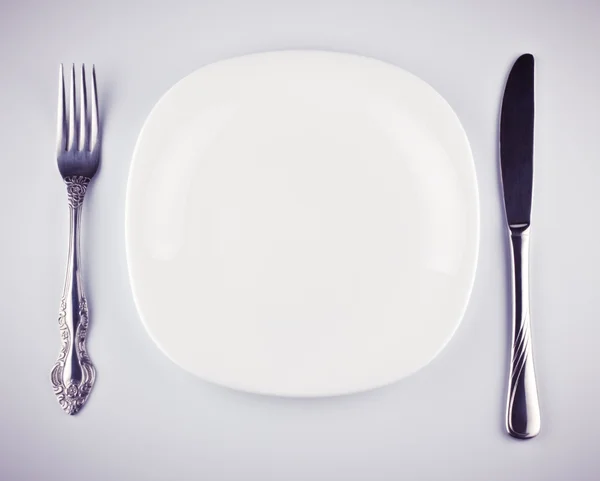 stock image Empty white dish knife and fork
