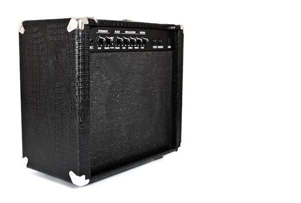 Black guitar amplifier isolated on white
