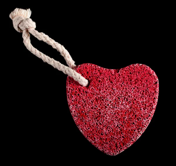 Red heart-shaped stone with rope Stock Image
